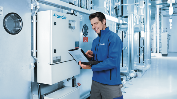 Technician configures a Condair humidity control system Technician configures a Condair humidity control system